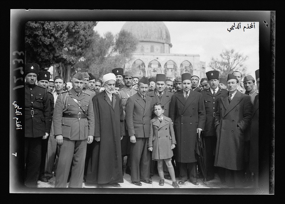                 Boy King Feisal II of Iraq on steps between Dome of the Rock & el-Aksa [i.e., al-Aqsa do.php?imgf=14150838